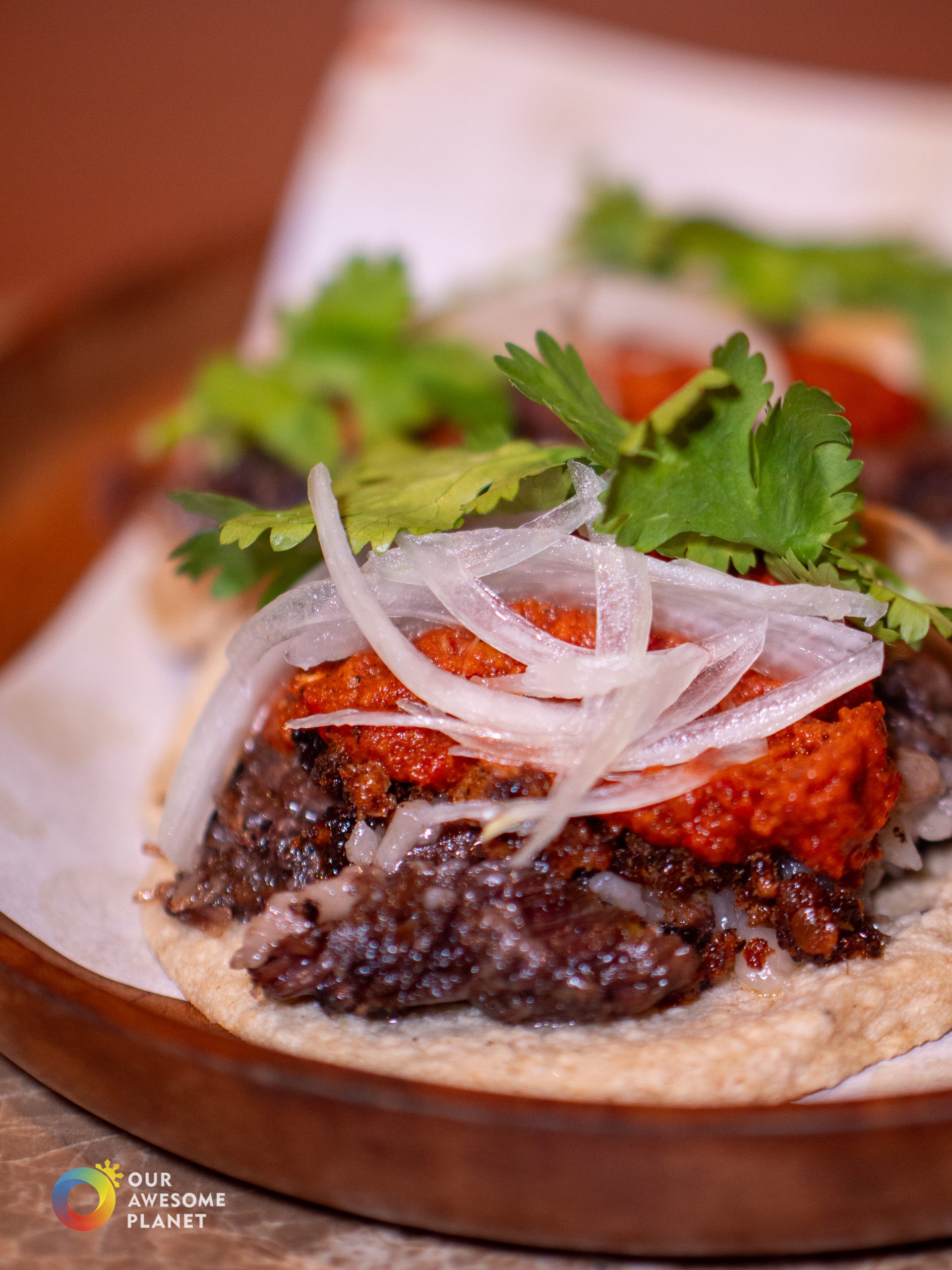 Campechano taco close-up with wagyu beef cheeks and chorizo